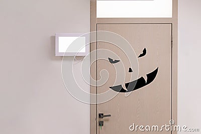 Door with black angry scary monster face. Stock Photo