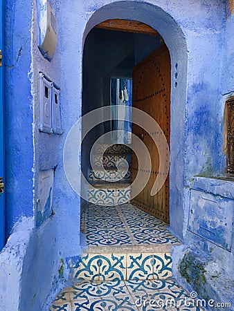 Door into the blue house of Allah Stock Photo