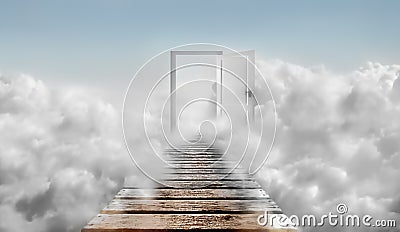 Door in blue sky and clouds. Door To Heaven. Stock Photo