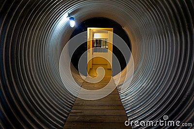 Door at end of tunnel Stock Photo