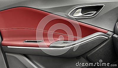 Door handle with Power window control buttons of a luxury passenger car. Red leather interior of the luxury modern car. Modern car Stock Photo