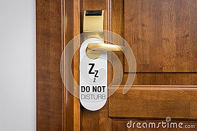 Door of hotel room with sign please do not disturb Stock Photo