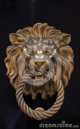 Door knob in the shape of brass lion Stock Photo