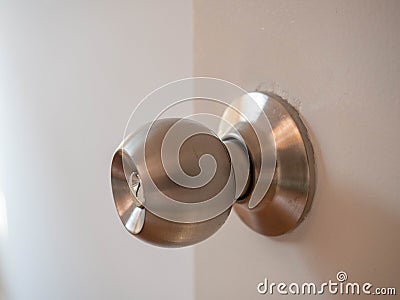 Door knob,On wood white door,Material Stainless,Beautiful lighting,Sunlight,Security lock,Closeup detail Stock Photo