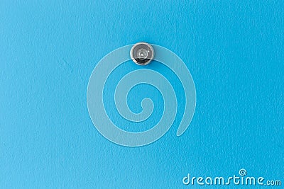 Door lens peephole on blue wooden texture Stock Photo