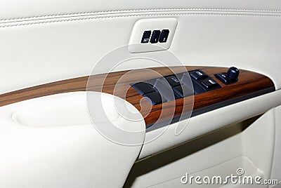 Car door interior inside panel handle vehicle modern transportation transport automobile design leather lock luxury control wood Stock Photo