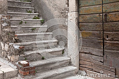 Door and stairway of abandoned mediterranean house Stock Photo