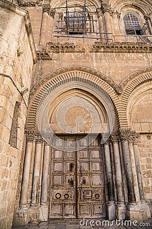 The door of the temple of the Holy Sepulcher Israel, Jerusalem. Wooden antique door with iron bars, closed due to quarantine Stock Photo
