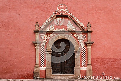 Door on the typical colonial church in Huichapan Stock Photo