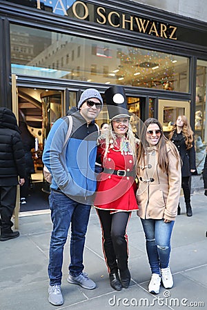 A doorman dressed as a toy soldier stands outside newly reopened the FAO Schwarz flagship store at Rockefeller Plaza Editorial Stock Photo