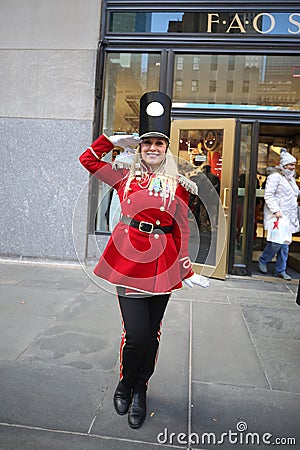 A doorman dressed as a toy soldier stands outside newly reopened the FAO Schwarz flagship store at Rockefeller Plaza Editorial Stock Photo