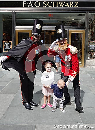 A doormen dressed as a toy soldier stand outside newly reopened the FAO Schwarz flagship store at Rockefeller Plaza Editorial Stock Photo