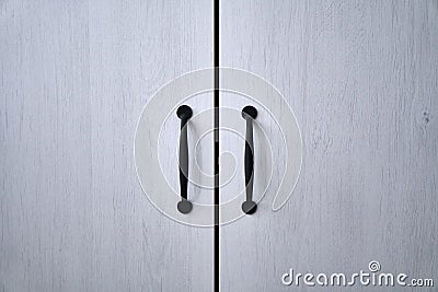 Doors with handles. Blue, white, grey. Wardrobe in the apartment. Style. MAcro. Stock Photo