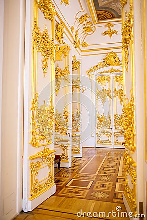 The doors of one of halls of a museum complex the Hermitage decorated with a gold stucco molding Editorial Stock Photo