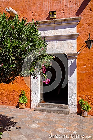 Doorway in a colourful red wall Stock Photo