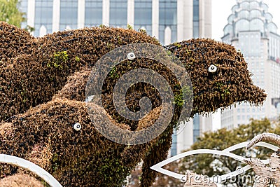 Dophin statue made of grass at the park of Shanghai, China Stock Photo