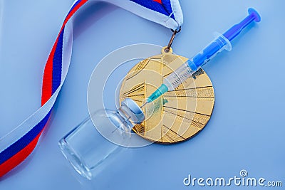 Doping in Sport, concept photo, syringe, medical ampoule and gold medal Stock Photo