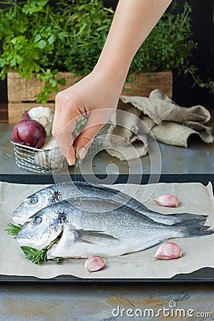 Dorade fish in cooking process Stock Photo