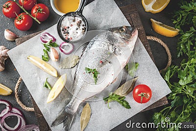 Dorado fish with ingredients for cooking Stock Photo