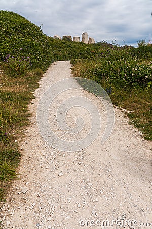 Pathway and vegetation in a disused quarry now a nature reserve, Isle of Portland, Dorset Editorial Stock Photo