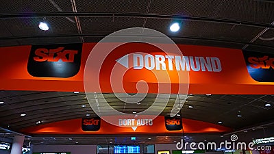 Dortmund, Germany - December 28, 2021: Sixt car rental employee waits for customers at Dortmund Airport Editorial Stock Photo