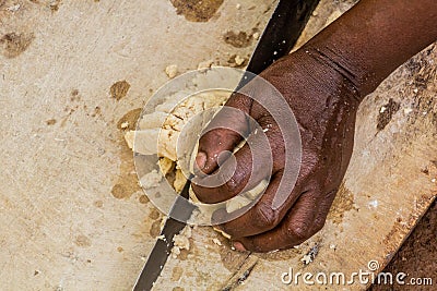 Dorze woman is preparing dough for kocho bread made of enset & x28;false banana& x29;, important source of food, Ethiop Stock Photo