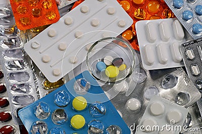 A daily dose of medication on the background of packaging with p Stock Photo