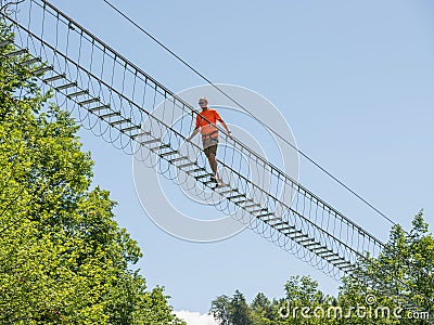 Dossena Italy 2022 Iron sun bridge suspended in the void to cross the valley on foot Editorial Stock Photo