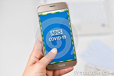 `NHS COVID-19` contact tracing app for monitoring the spread of the COVID-19 pandemic in the UK Editorial Stock Photo