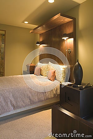 Double Bed With Wooden Headboard Stock Photo