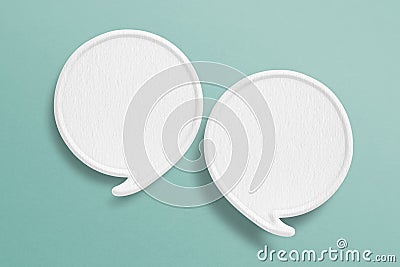 Two blank white speech bubble with border paper cut on grunge green paper background. Conceptual image about communication and Stock Photo