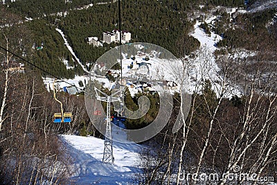 Double chair lift on the slope of Mount Cheget Stock Photo