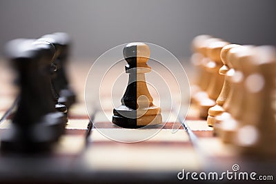 Double Color Pawn Amidst Other Chess Pieces On Board Stock Photo