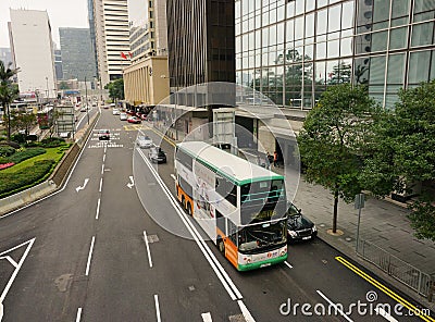 Double-deck bus running in Hong Kong Editorial Stock Photo