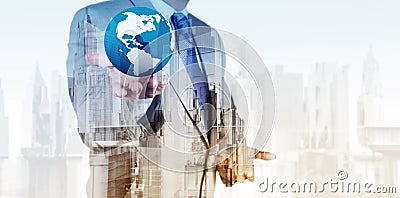 Double exposure of business engineer holding the earth Stock Photo