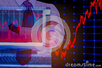 Double exposure business man, computer and stock chart as background, With concept of risk and volatility of investment world Stock Photo