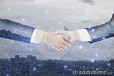 Double exposure-businessman handshake with businesswoman deal and agree to negotiate mission complete,background cityscape with Stock Photo