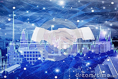 Double exposure-businessman handshake with businesswoman negotiate mission complete,background cityscape and graph stock with Stock Photo