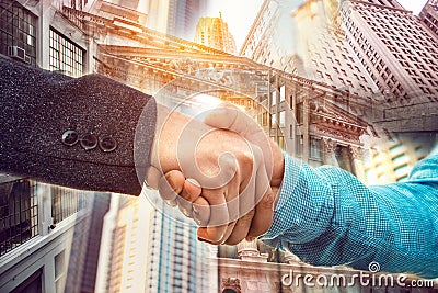 Double exposure of businessman handshake on New York City Wall Street background Stock Photo