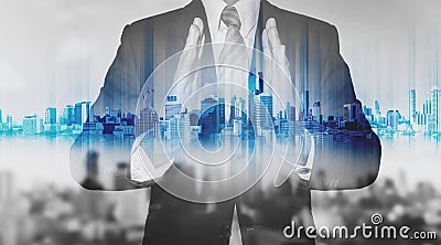 Double exposure businessman holding blue city hologram, real estate business technology Stock Photo