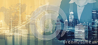 Double exposure of businesswoman arms crossed and urban building Stock Photo