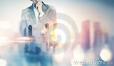 Double exposure of city and business man with light effects Stock Photo