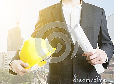 Double exposure of engineer holding helmet on on Sky train Stock Photo