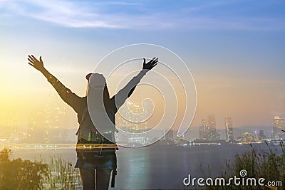 Double exposure Freedom traveler woman standing with raised arms and enjoying a beautiful nature and cheering young woman backpack Stock Photo