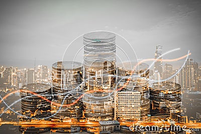 Double exposure of graph and coin stacks growing growth stacks with modern city. Stock Photo