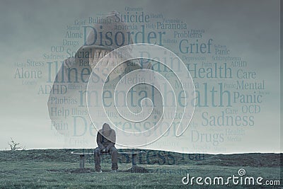 A double exposure of a hooded figure with his head in his hands over a lonely hooded figure sitting on a park bench, looking sad, Stock Photo