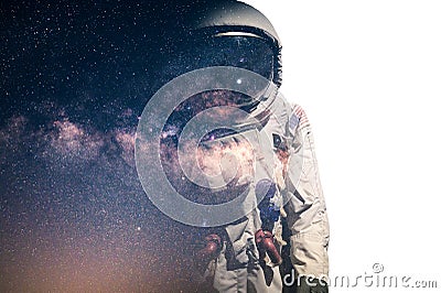 The double exposure image of the astronaut`s suit overlay with the milky way galaxy image. the concept of imagination, technology, Stock Photo