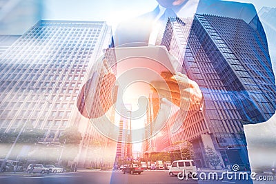 Double exposure image of businessman using digital tablet on city blurred background. Business success concept Stock Photo
