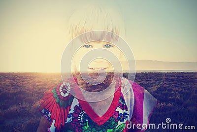 Double exposure image of a little blonde girl and summer sunset; retro styele Stock Photo