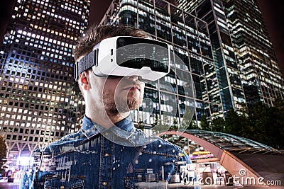 Double exposure, man wearing virtual reality goggles, night city Stock Photo